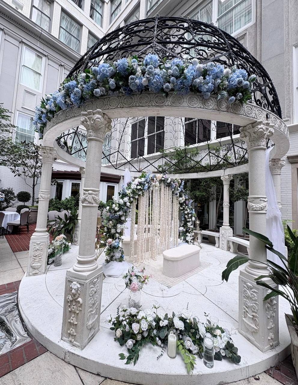 Grand gazebo with blue florals at Carissa Venue